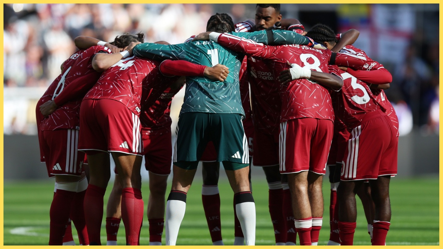 Liverpool players form a huddle before their match against Newcastle