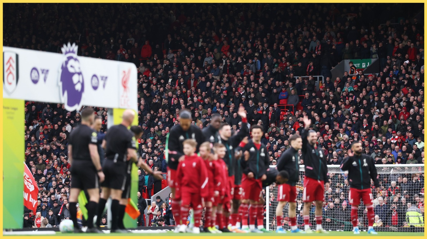 Liverpool players wave to the fans prior to kick-off at Anfield