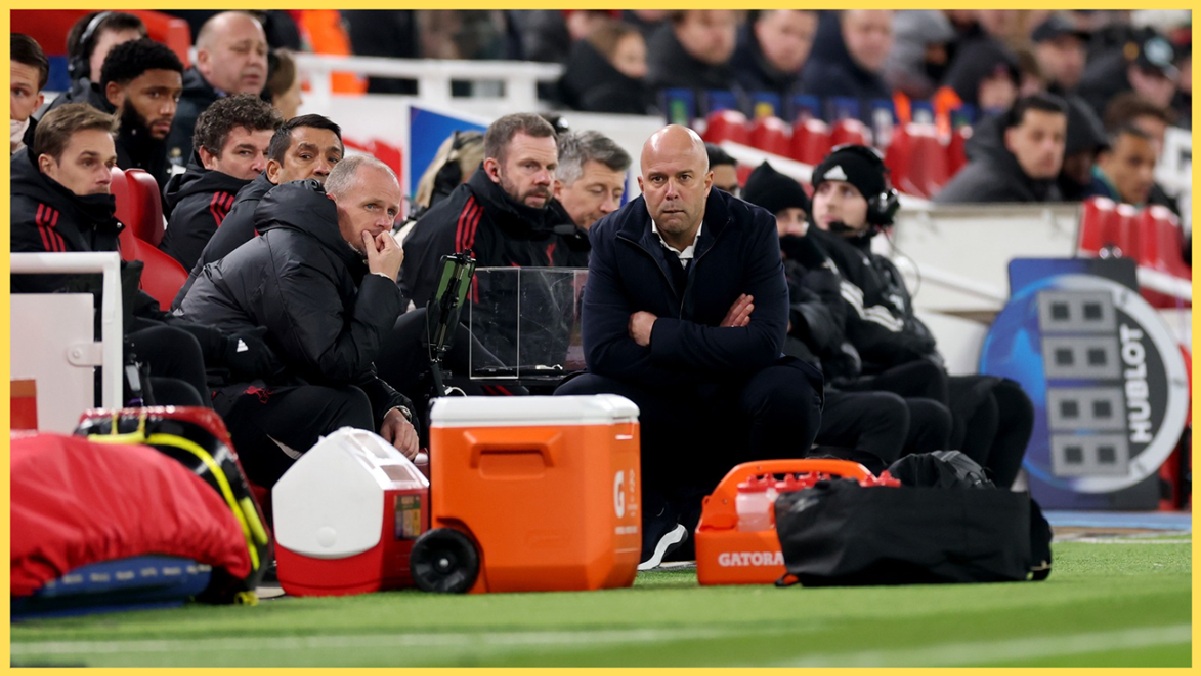 Arne Slot and his coaching staff watch on with grim faces at Anfield