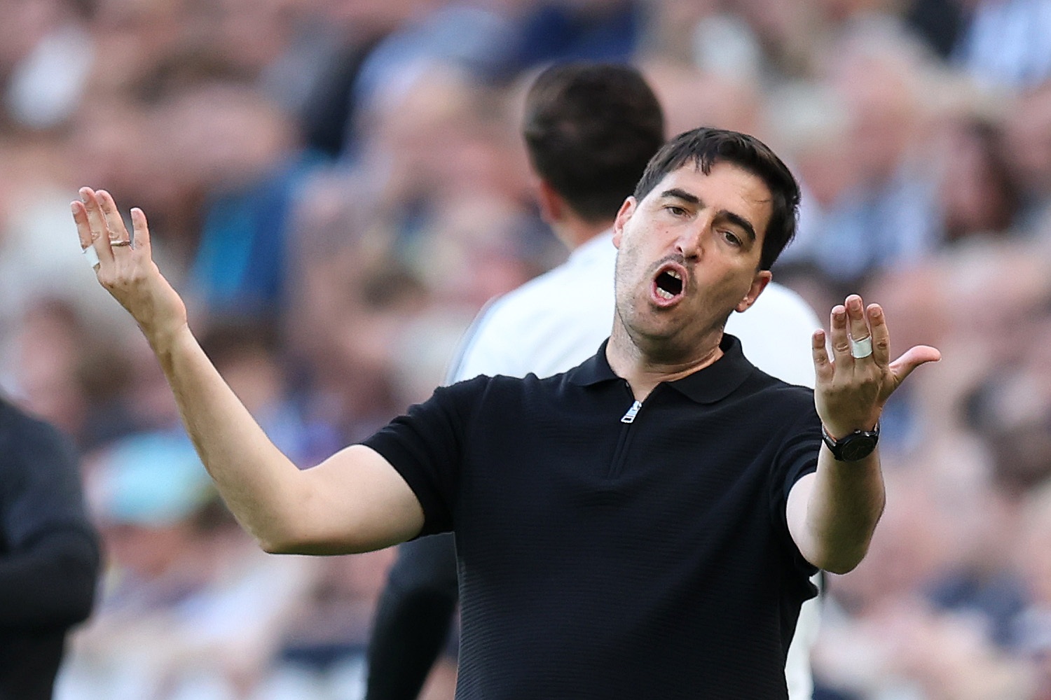 Andoni Iraola expresses frustration on the touchline during Liverpool match.