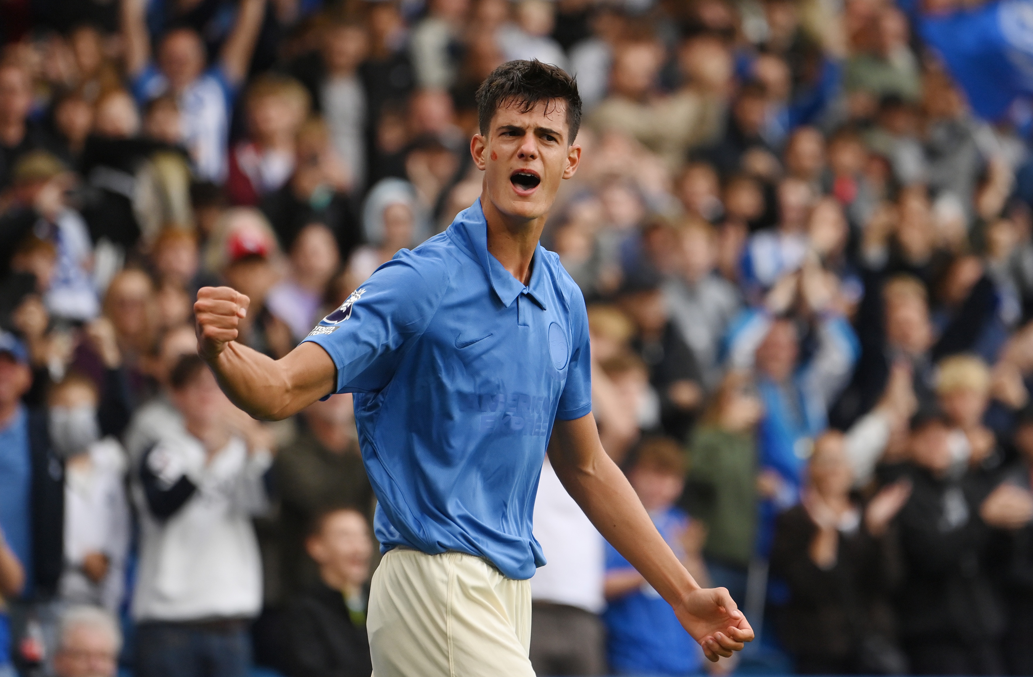 Brighton midfielder Chema Andres raises his clenched fist in celebration after scoring vs Arsenal.