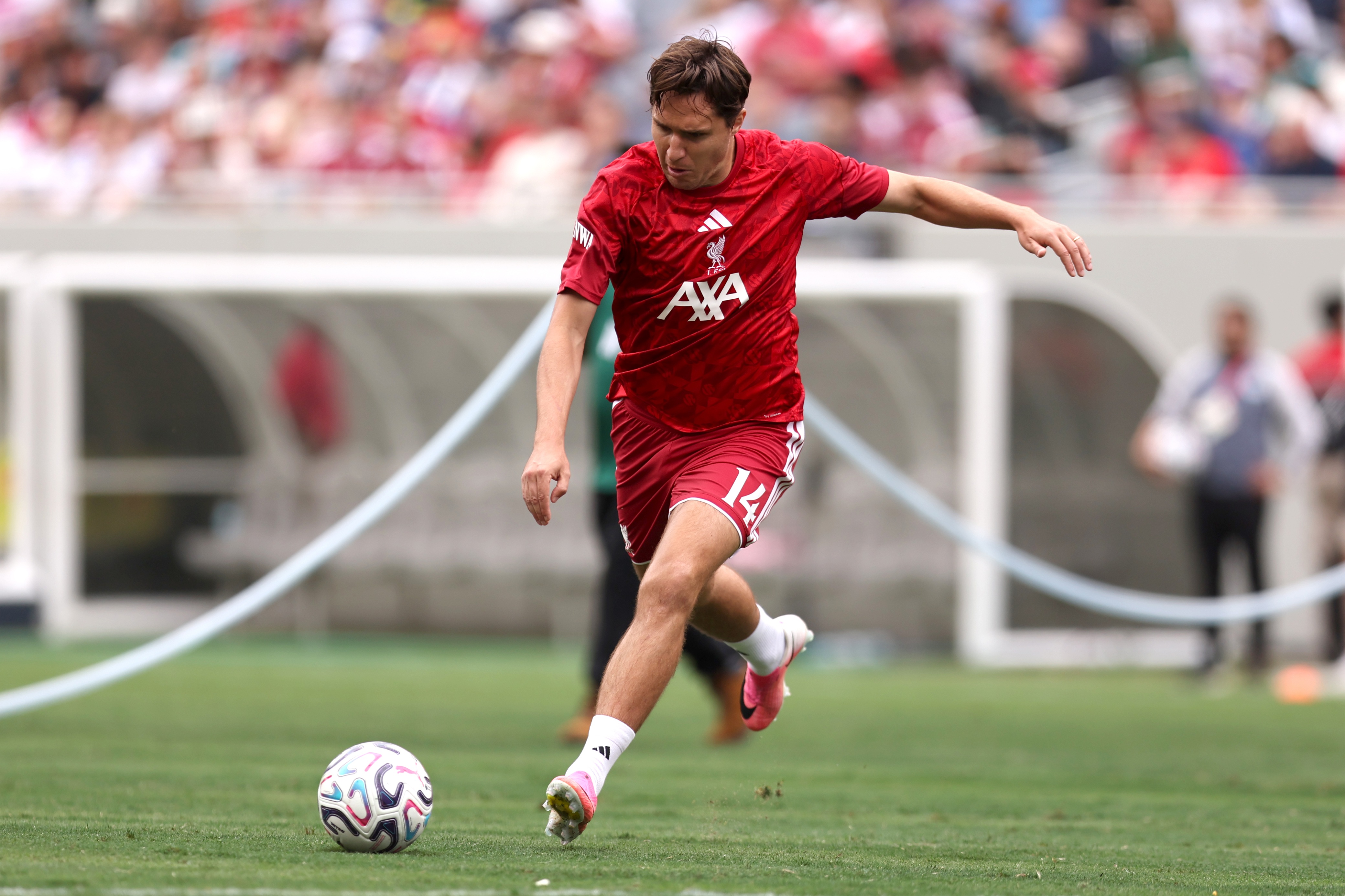 Liverpool forward Federico Chiesa prepares to strike a football.