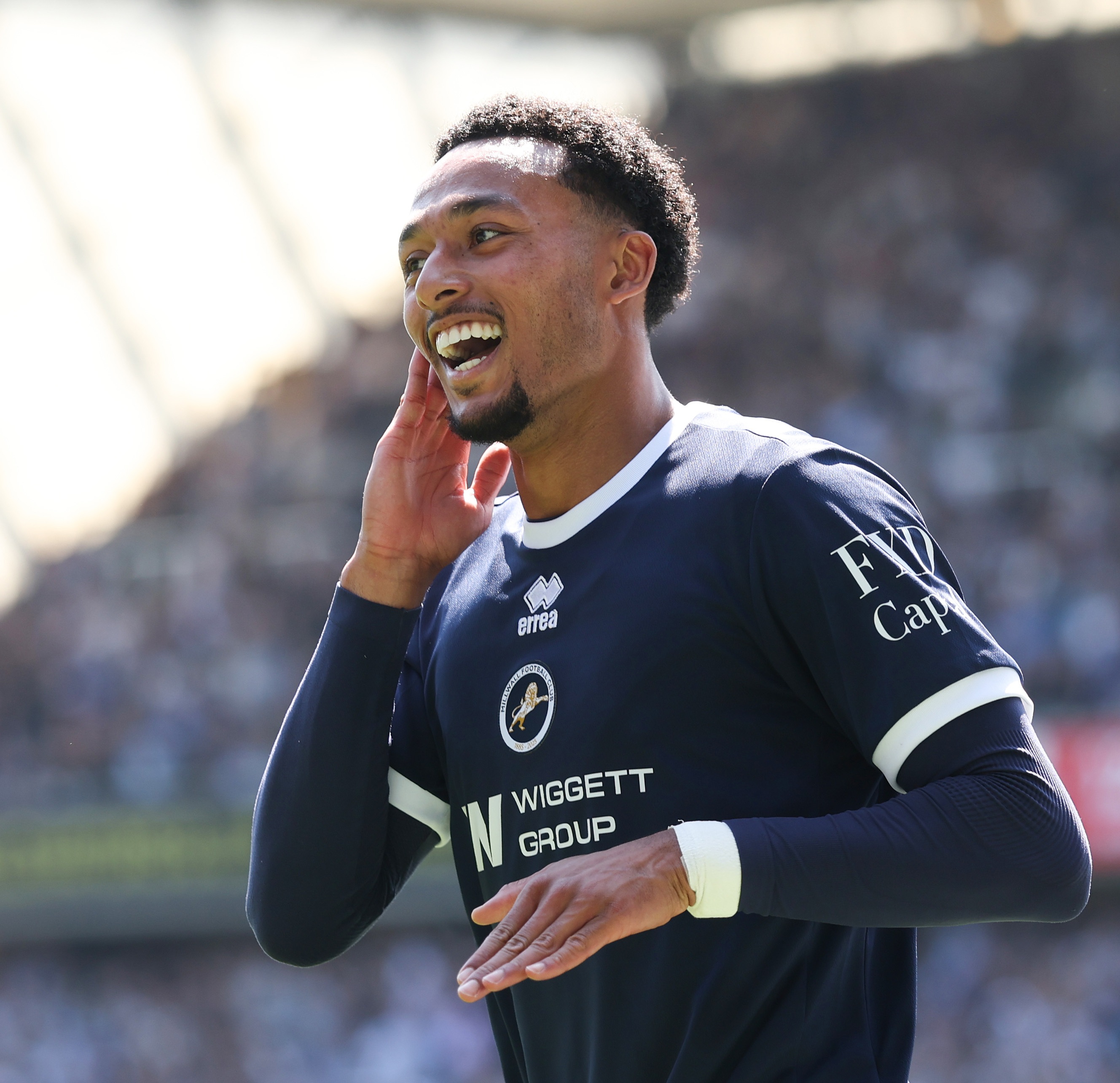 Brighton winger Femi Azeez celebrates during Milwall game.