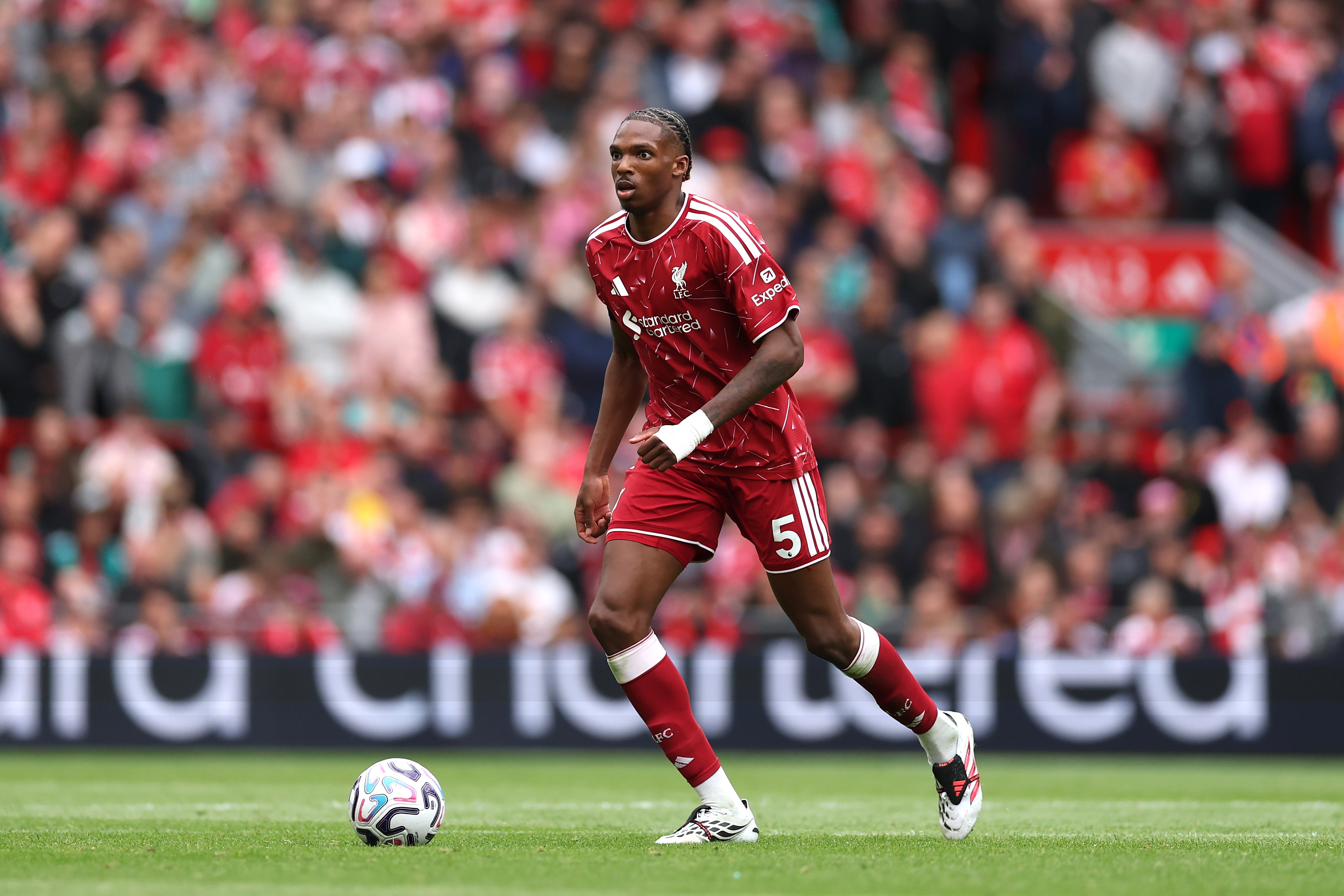 Liverpool centre-back Jeremy Jacquet dribbles with the ball at Anfield.