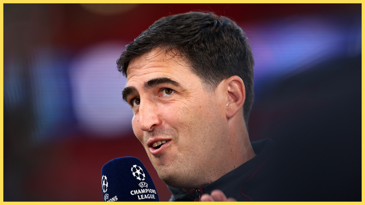 Liverpool manager Andoni Iraola speaks into a microphone.