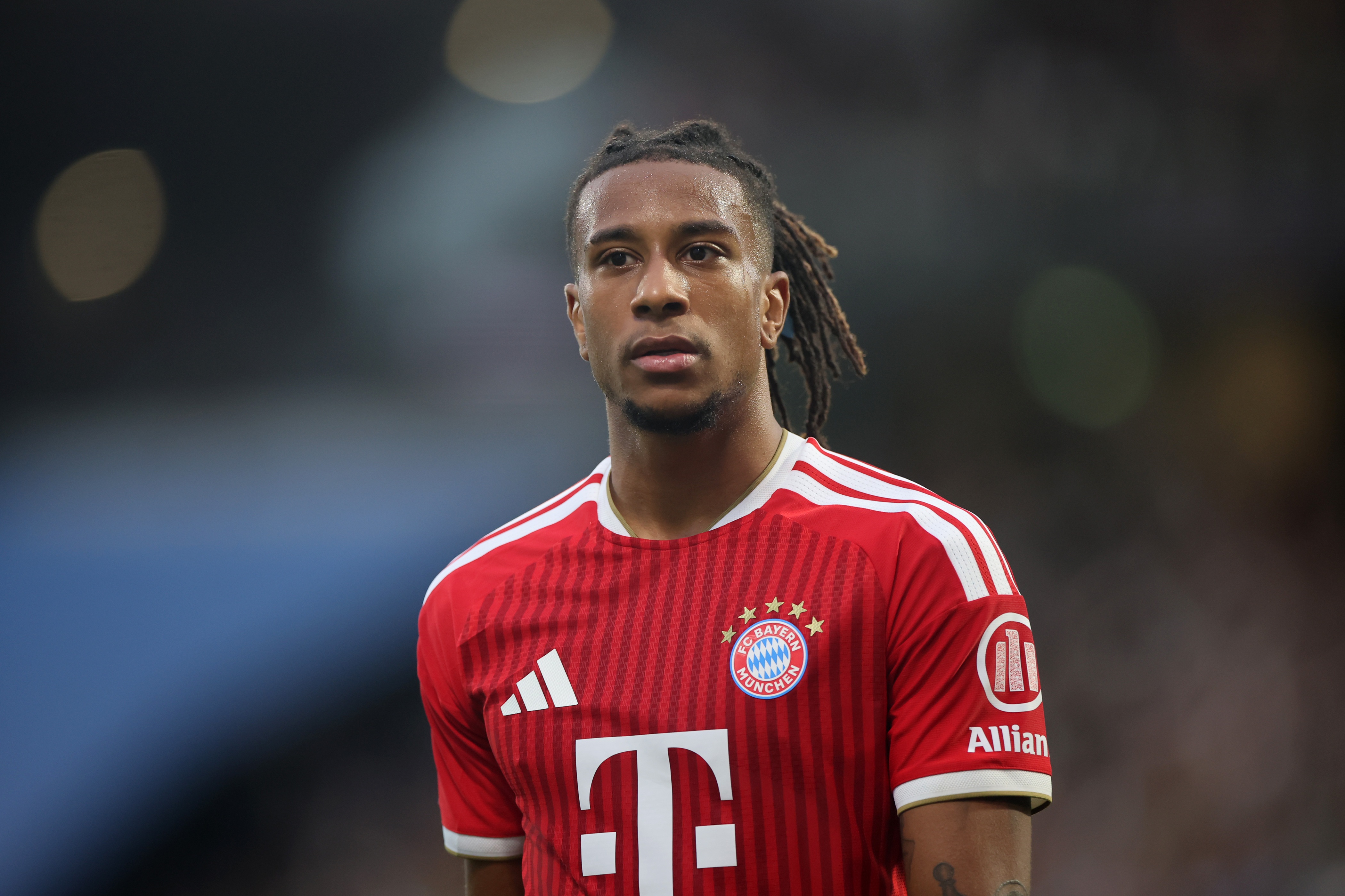 Bayern Munich attacker Michael Olise looks on during Bundesliga game.