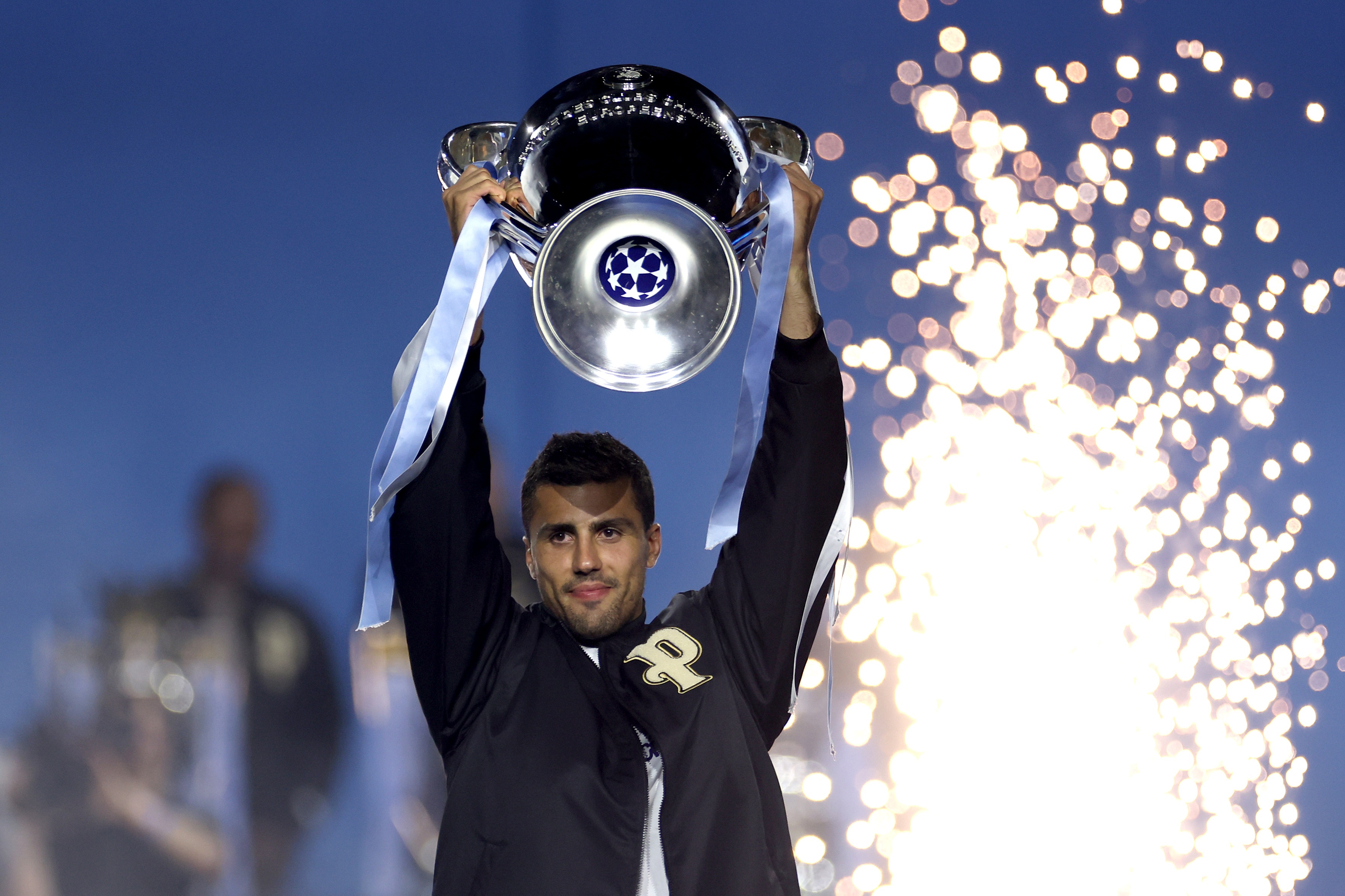 Manchester City midfielder Rodri lifts the Champions League trophy.