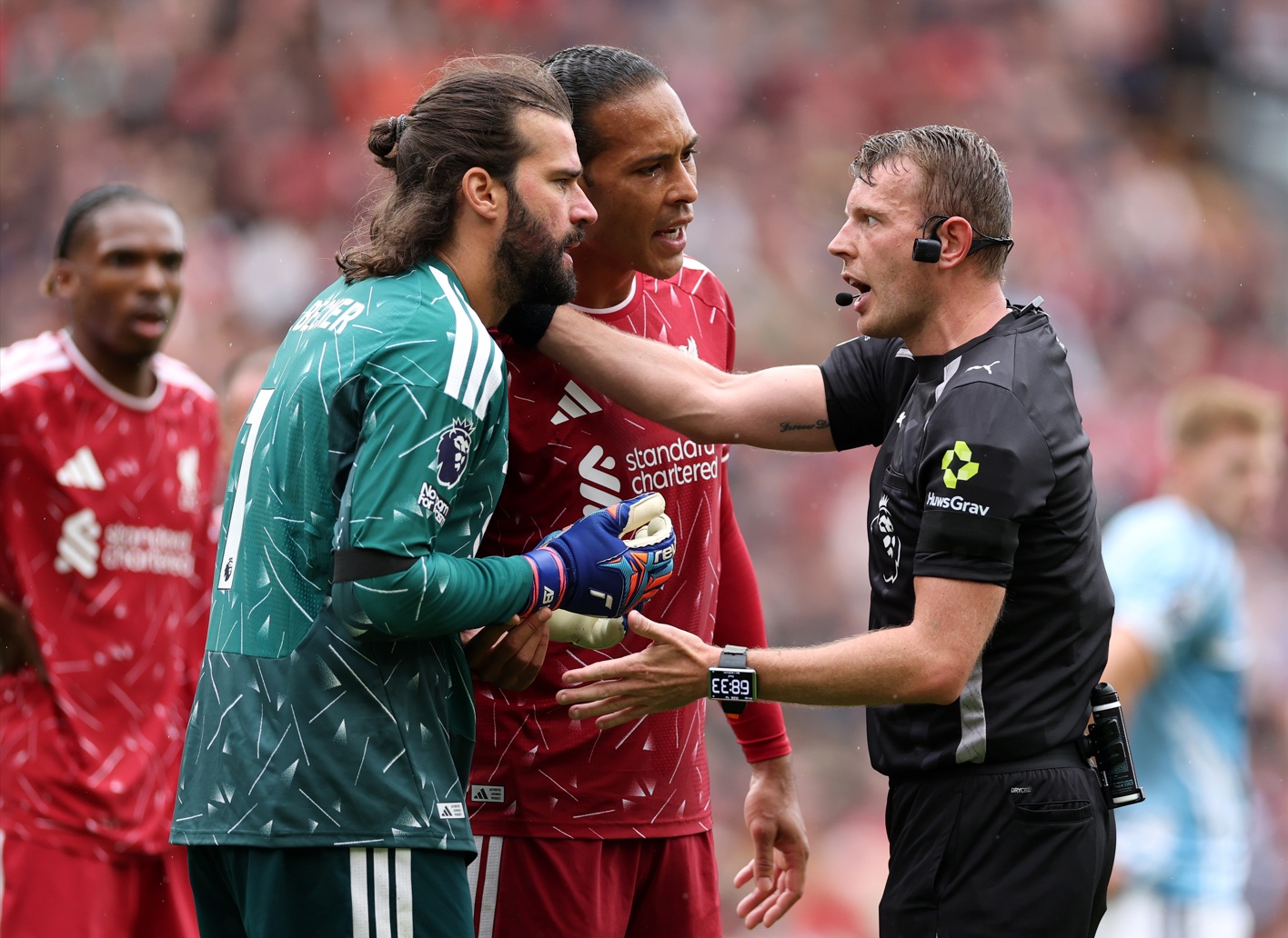 Alisson Becker argues with referee Sam Barrott after conceding a penalty to Nottingham Forest