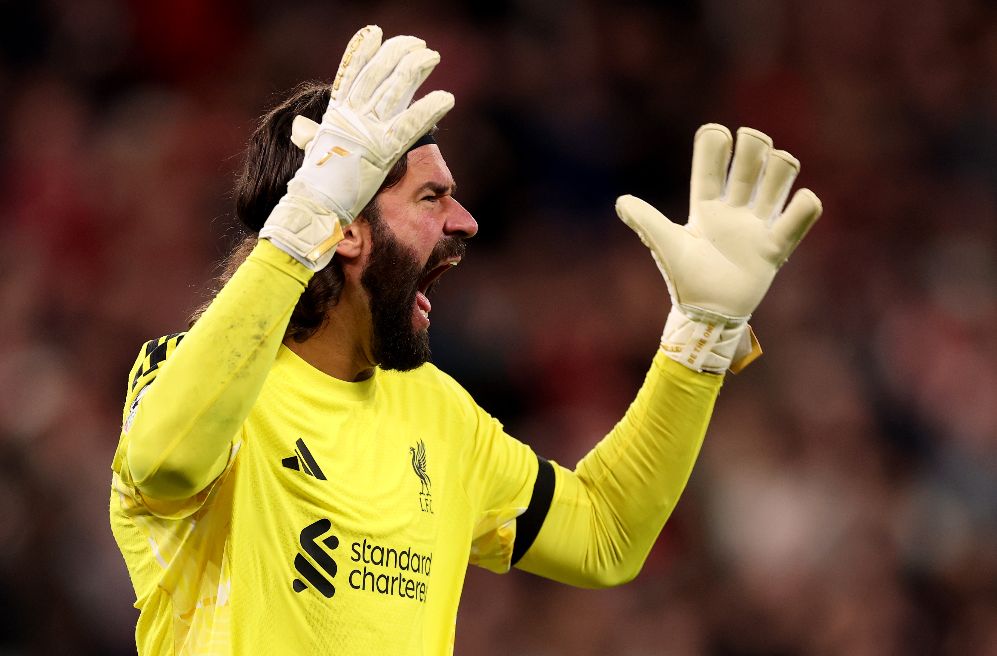 Alisson Becker shouts at his Liverpool teammates