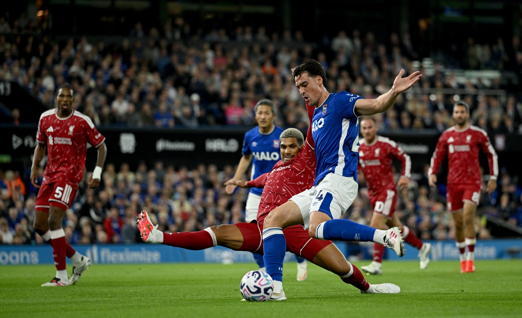 Ronald Araujo puts in a tackle on Jacob Greaves