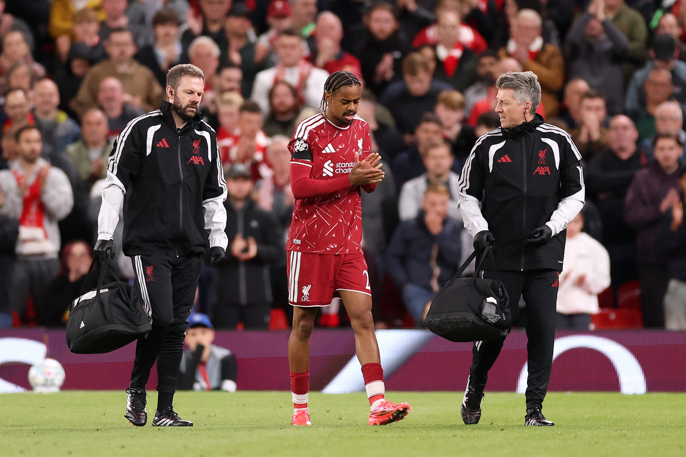 Bradley Barcola receives attention from the Liverpool medical staff