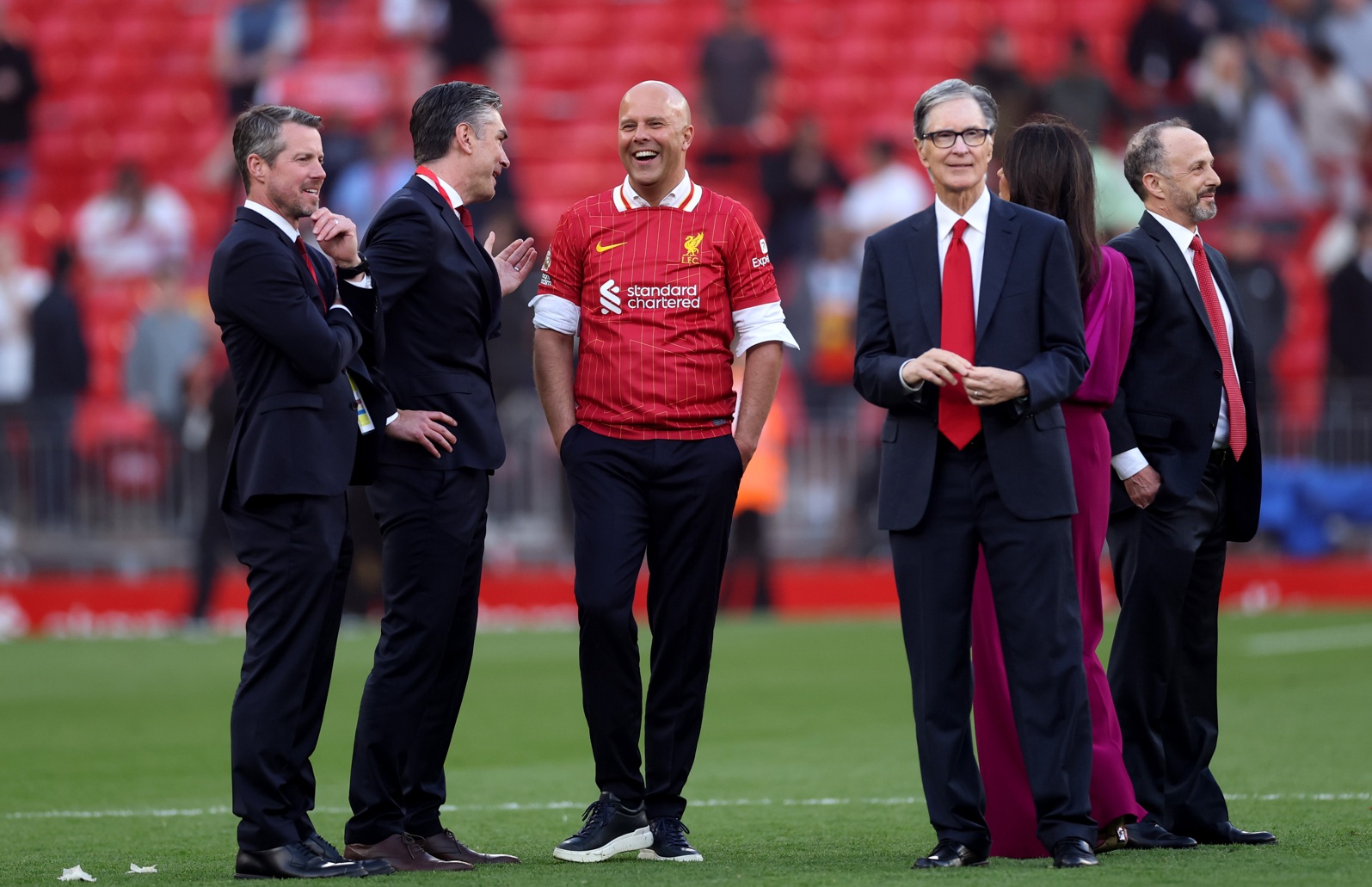 Richard Hughes speaks to Arne Slot after Liverpool's Premier League title victory in 2025