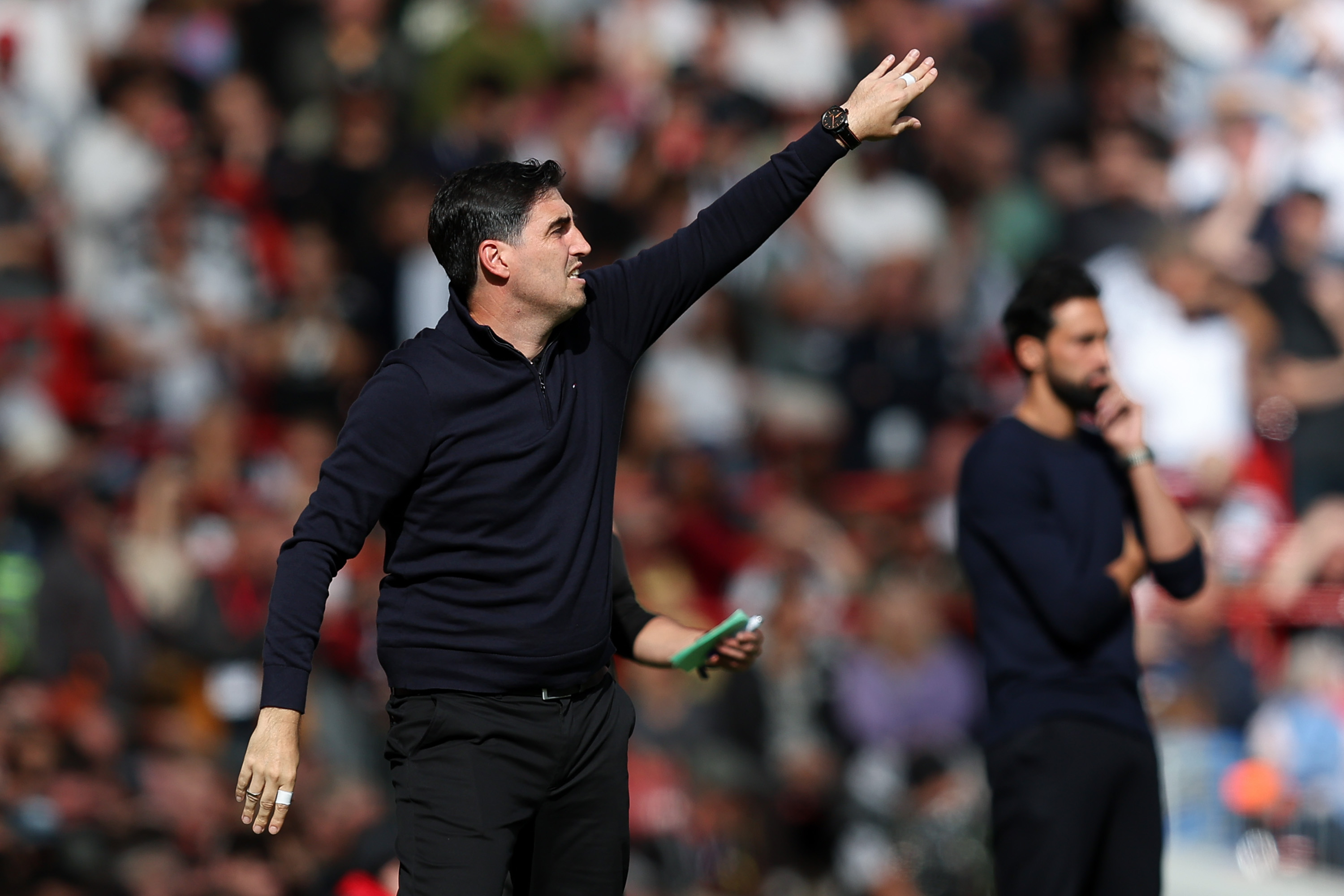 Andoni Iraola gestures to his Liverpool players from the touchline