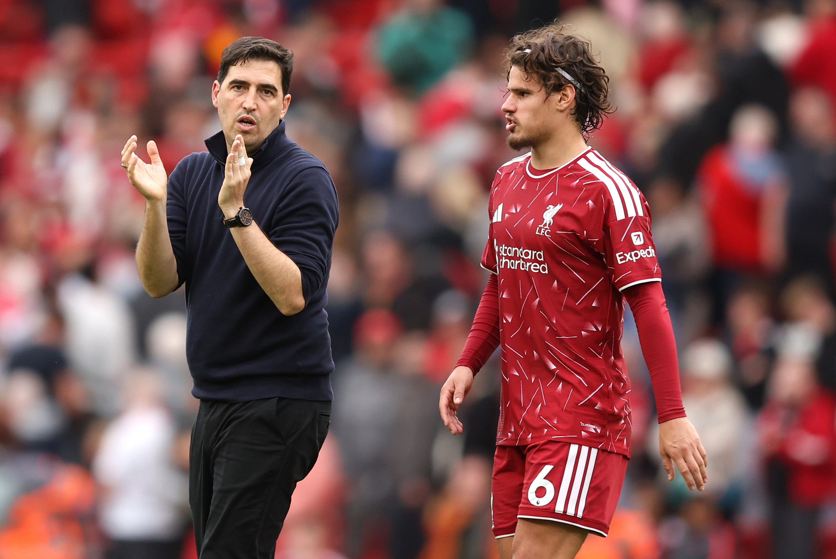 Andoni Iraola applauds alongside Milos Kerkez