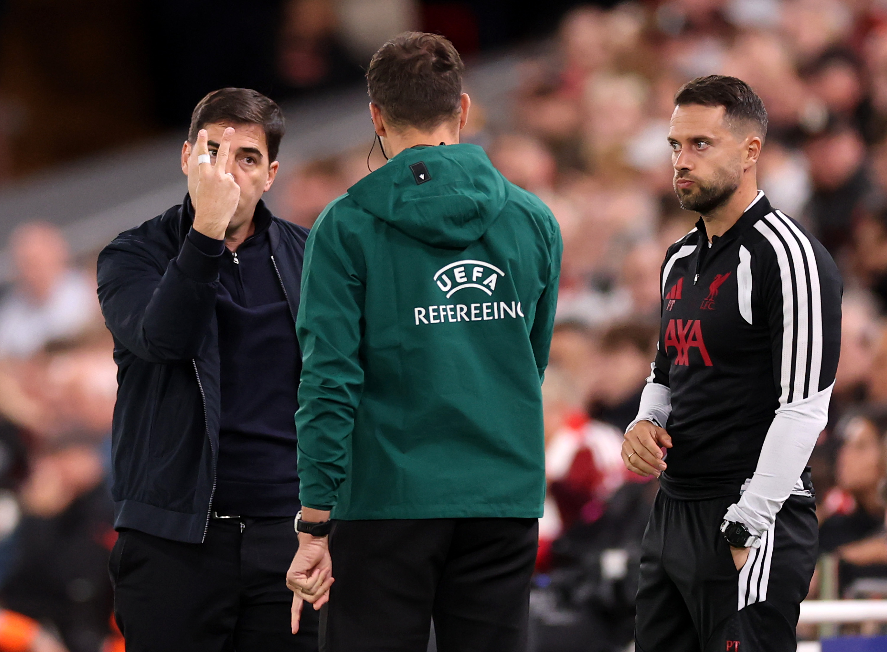 Andoni Iraola has words with fourth official Matteo Marcenaro during Liverpool's win over Atletico Madrid