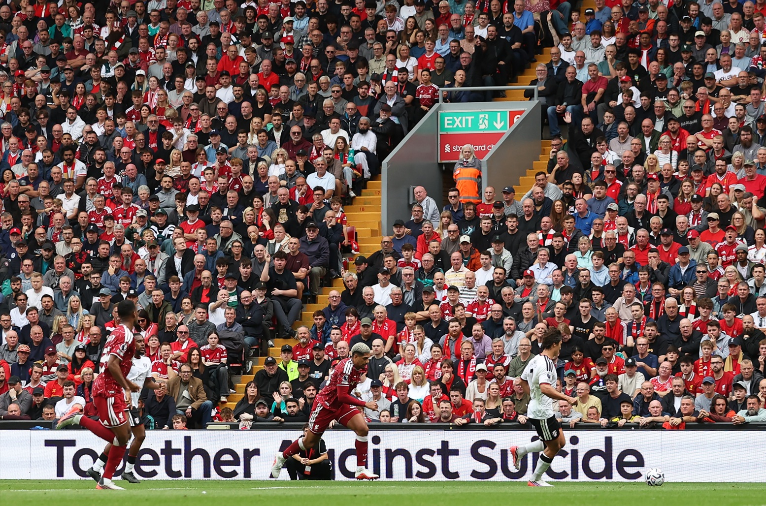 Liverpool fans watch their team in action at Anfield