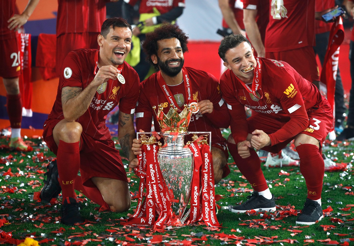 Dejan Lovren, Mo Salah and Xherdan Shaqiri brandish their Premier League winners' medals in 2020