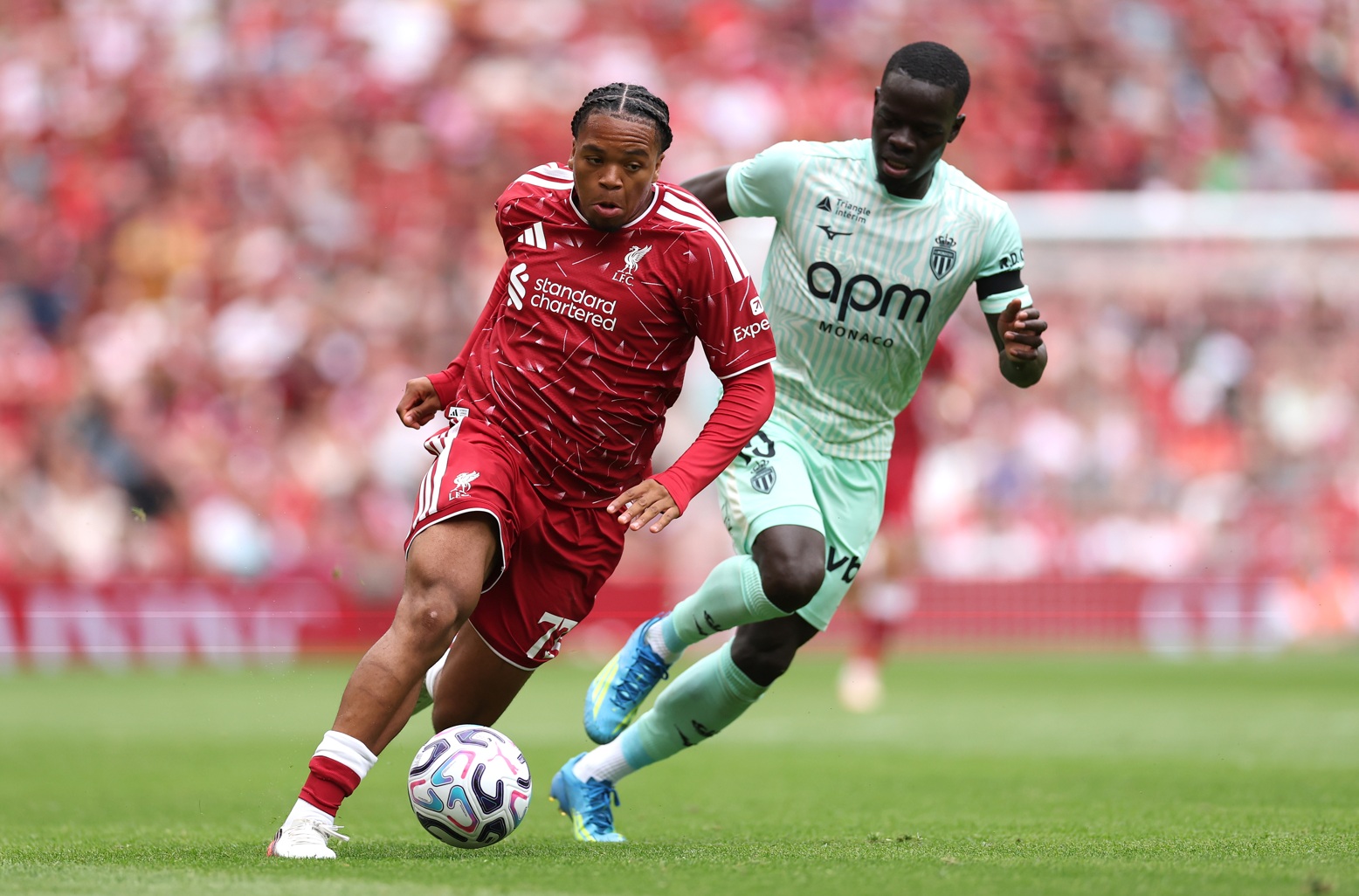Rio Ngumoha gets away from Monaco midfielder Pape Cabral