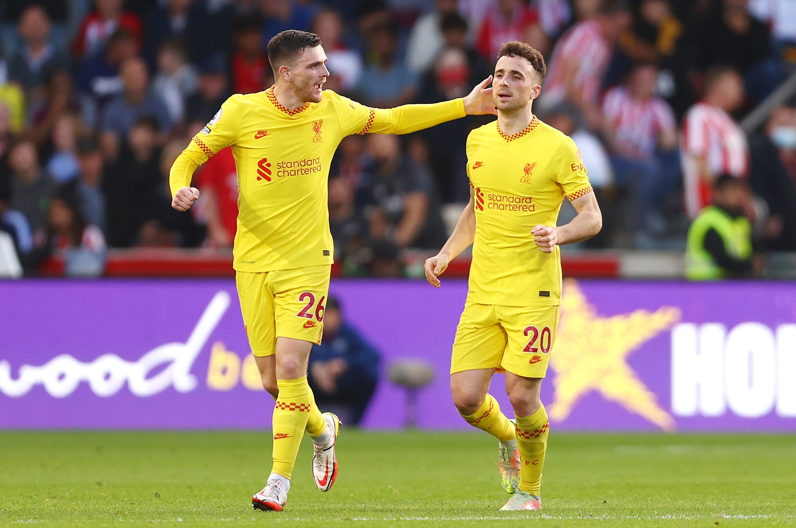 Andy Robertson and Diogo Jota celebrate a goal for Liverpool at Brentford in 2021