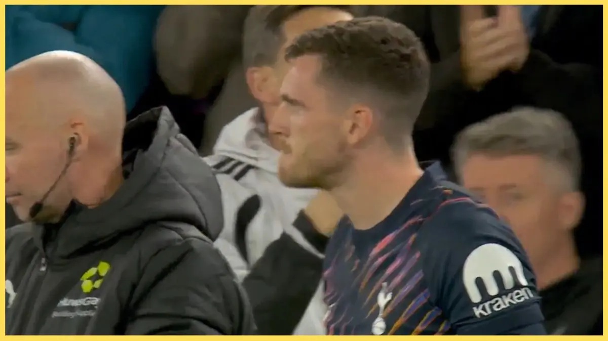 Andy Robertson prepares to come on for Spurs against Liverpool at Anfield