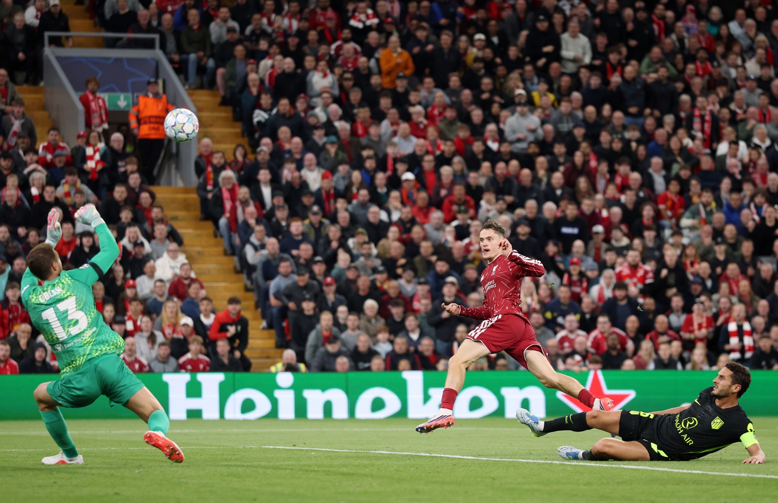 Florian Wirtz has an attempt on goal against Atletico Madrid
